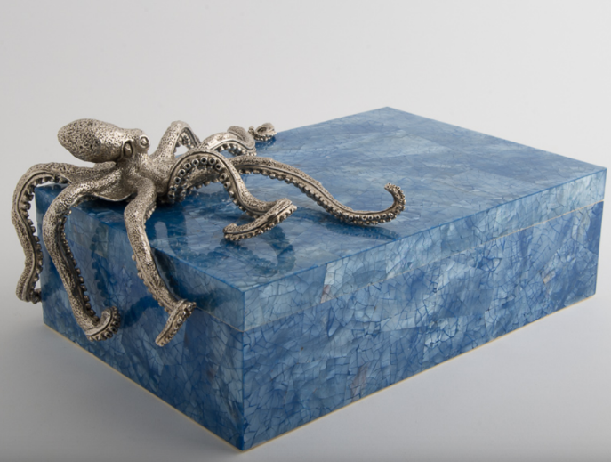 silver octopus on blue marble block