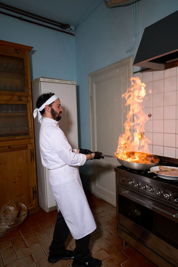 Chef cooking with a flame